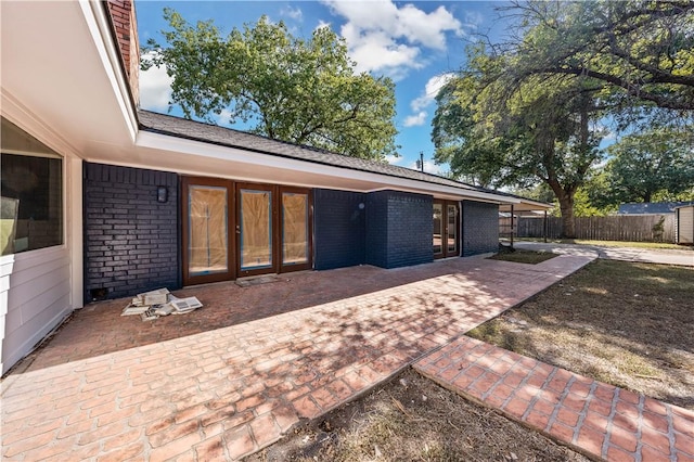 back of house with a patio