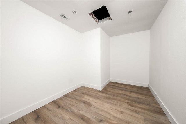 empty room featuring hardwood / wood-style flooring