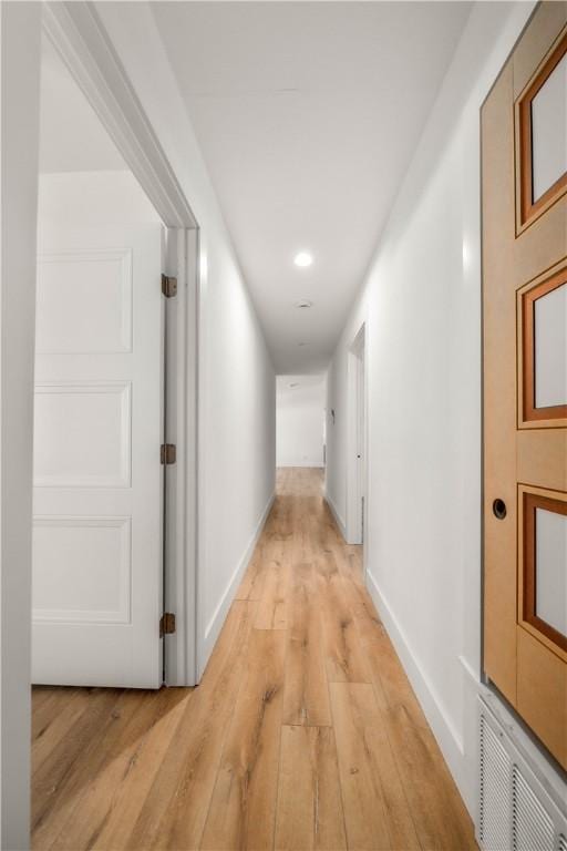 corridor featuring light hardwood / wood-style flooring