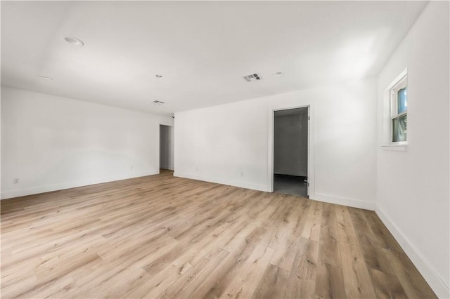 unfurnished room featuring light wood-type flooring