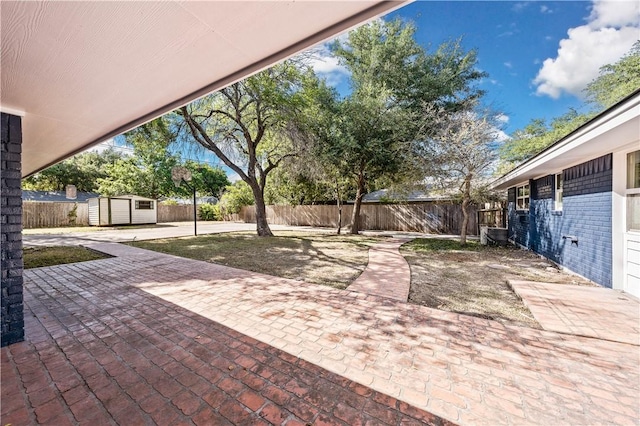 view of patio featuring a shed