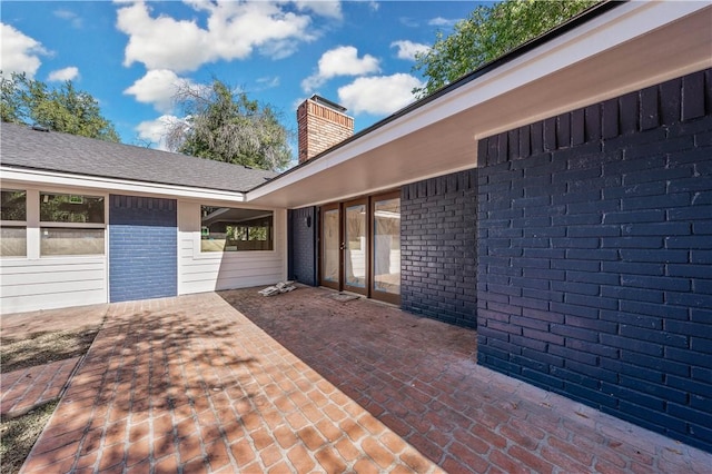 doorway to property featuring a patio area