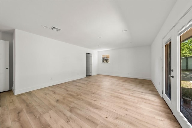 spare room featuring light hardwood / wood-style floors