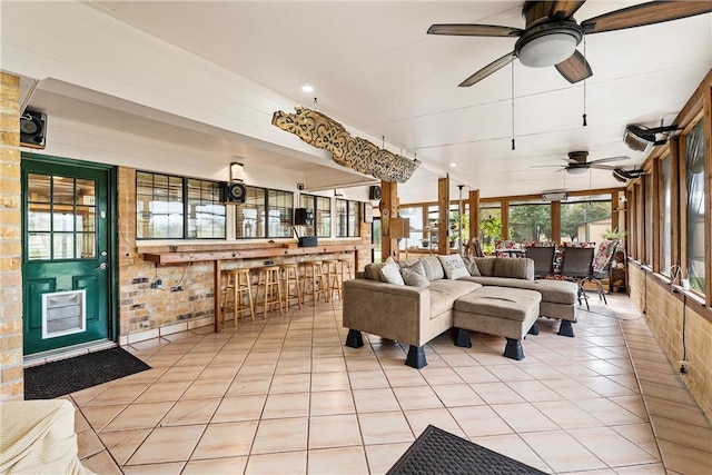 interior space with ceiling fan