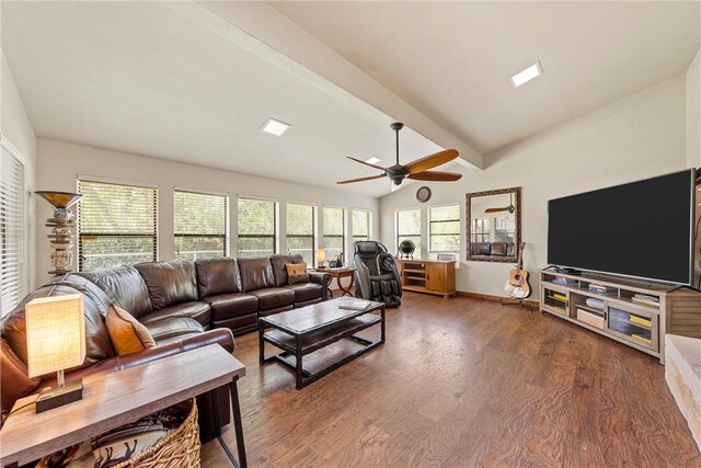 living room featuring lofted ceiling with beams, dark hardwood / wood-style floors, and ceiling fan