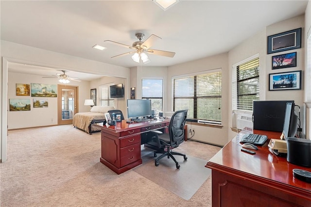 office space with ceiling fan and light colored carpet