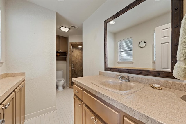 bathroom with tile patterned flooring, vanity, and toilet