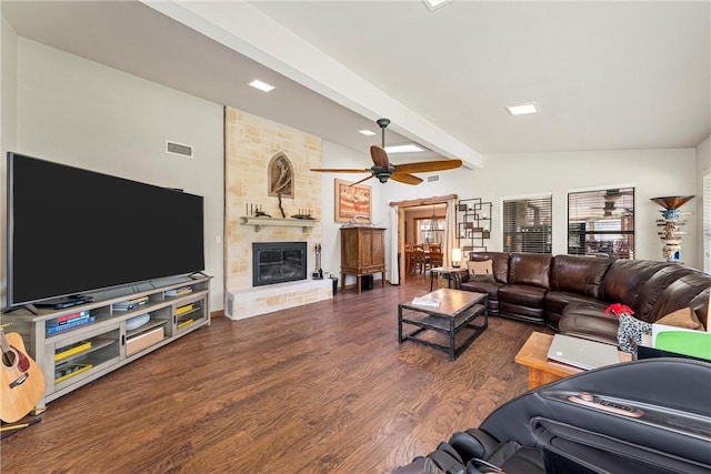 living room with a large fireplace, dark hardwood / wood-style floors, ceiling fan, and lofted ceiling