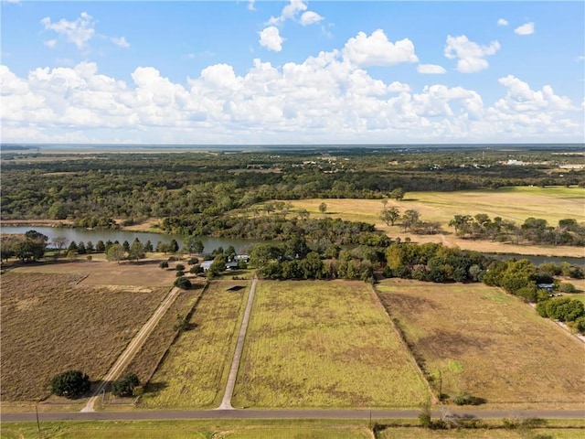 drone / aerial view featuring a rural view and a water view