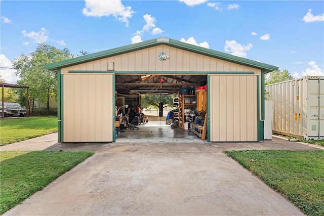 view of outbuilding featuring a lawn