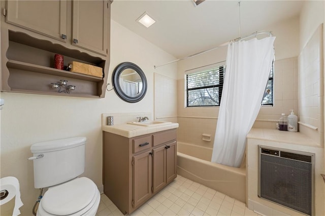 full bathroom featuring shower / bath combination with curtain, tile patterned floors, vanity, heating unit, and toilet