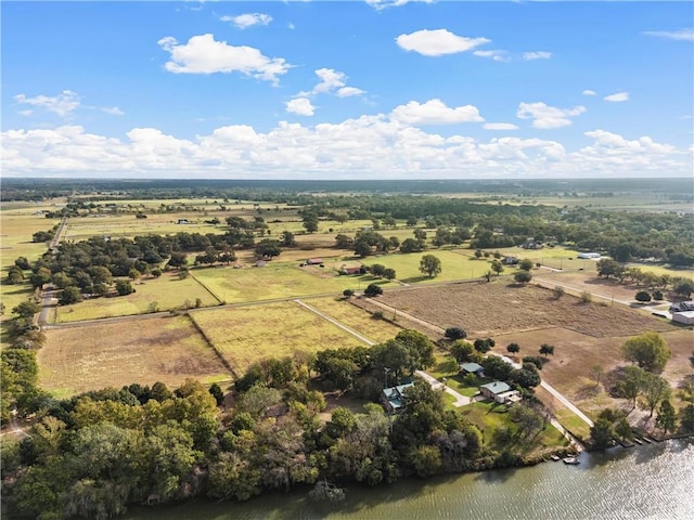 birds eye view of property with a water view and a rural view