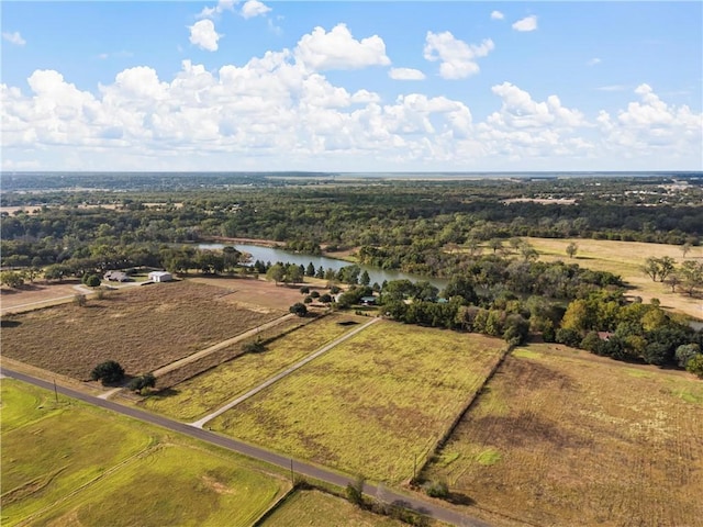 bird's eye view with a water view and a rural view