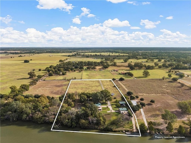 birds eye view of property with a rural view and a water view