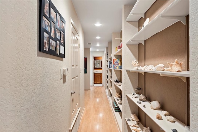 hallway featuring light hardwood / wood-style flooring