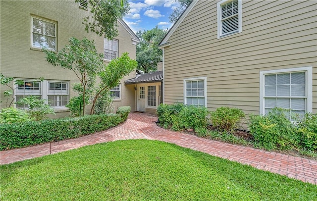 property entrance with a yard