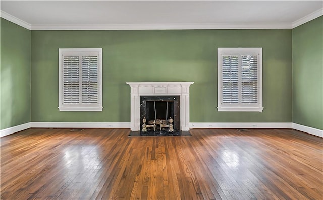 unfurnished living room featuring a premium fireplace, dark hardwood / wood-style flooring, and crown molding