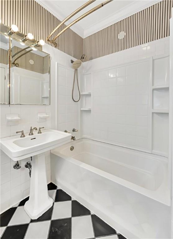 bathroom with shower / bath combination, tasteful backsplash, and crown molding