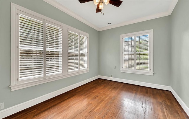 unfurnished room featuring ceiling fan, wood-type flooring, and ornamental molding