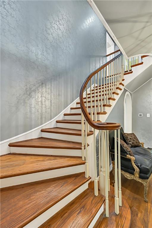 stairs with hardwood / wood-style floors