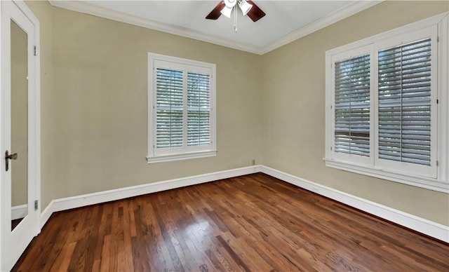 empty room featuring crown molding, ceiling fan, and dark hardwood / wood-style floors