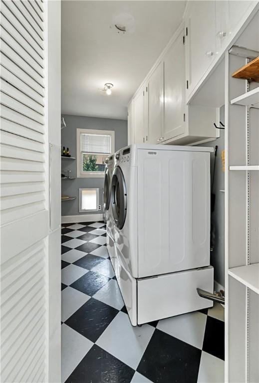 washroom with cabinets and separate washer and dryer