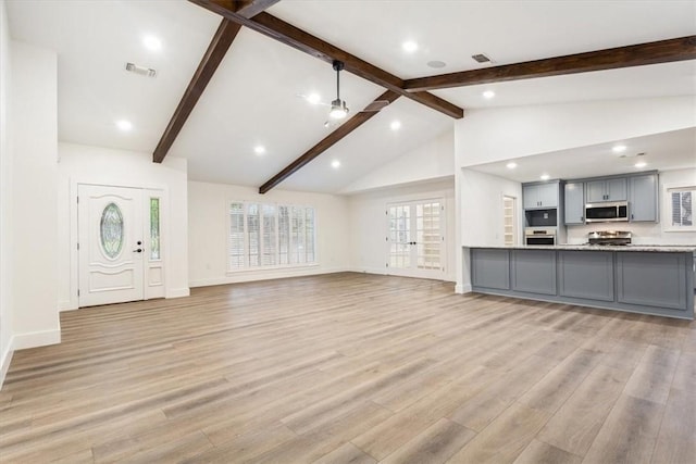 unfurnished living room featuring light hardwood / wood-style floors, high vaulted ceiling, and beamed ceiling