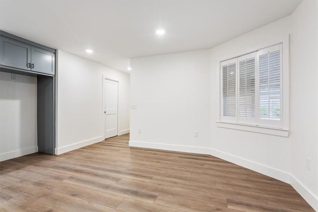 unfurnished room with light hardwood / wood-style floors