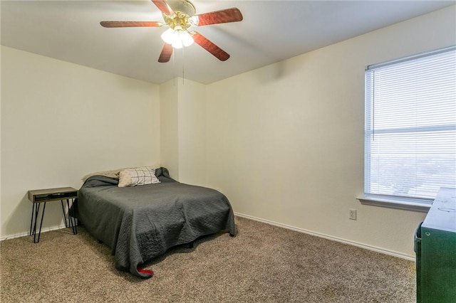 bedroom with carpet flooring, ceiling fan, and baseboards