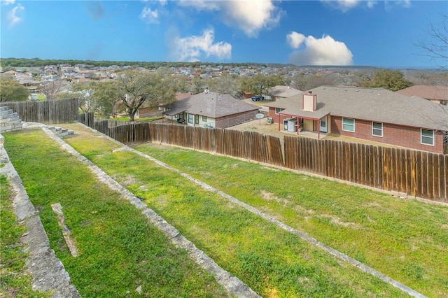 view of yard with a fenced backyard