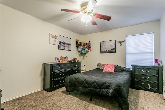 bedroom with ceiling fan and carpet floors