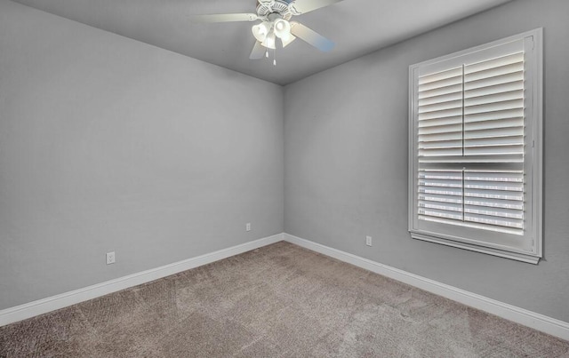 unfurnished room featuring ceiling fan and light carpet