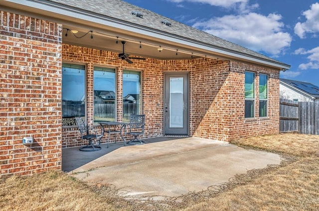 doorway to property with a patio and ceiling fan