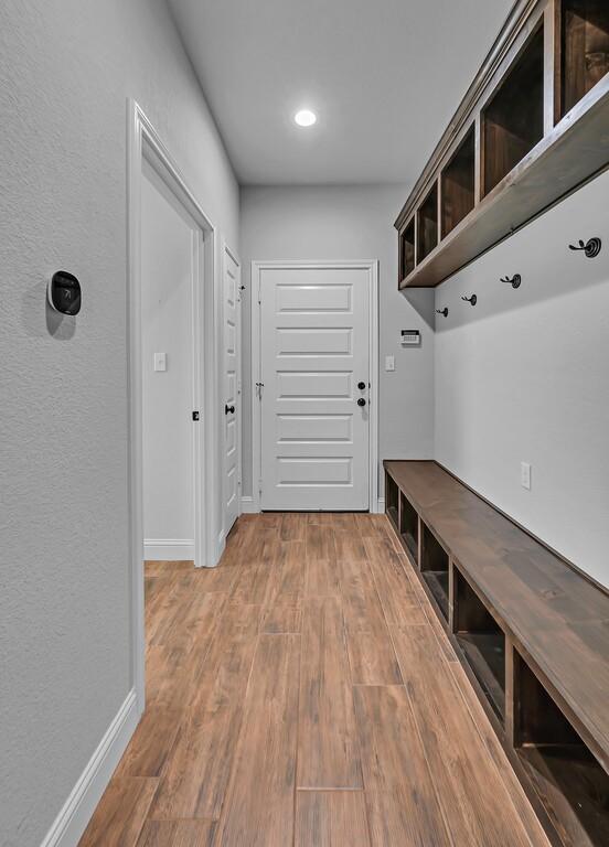 mudroom with hardwood / wood-style flooring