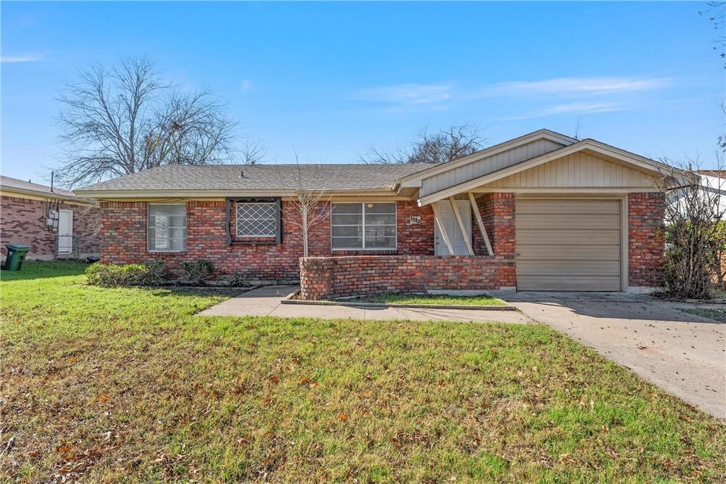 single story home featuring a front yard and a garage