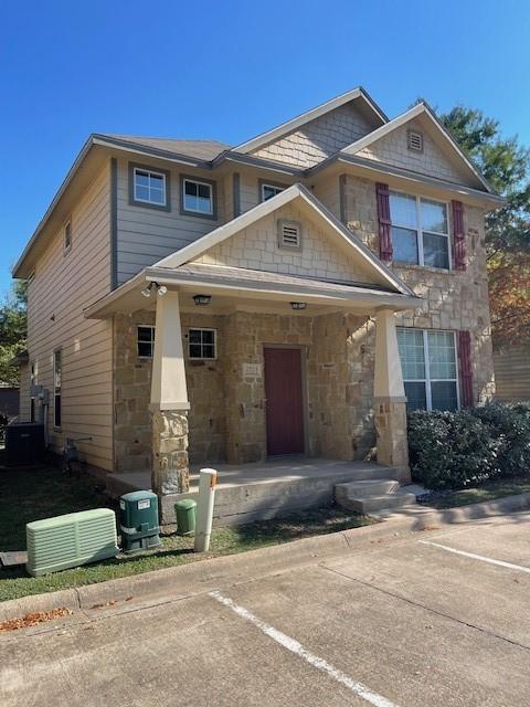 craftsman house with stone siding