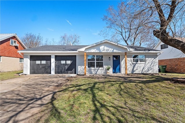 ranch-style house with concrete driveway, brick siding, an attached garage, and a front lawn