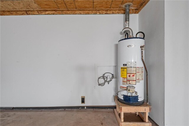 interior details featuring water heater, baseboards, and unfinished concrete floors