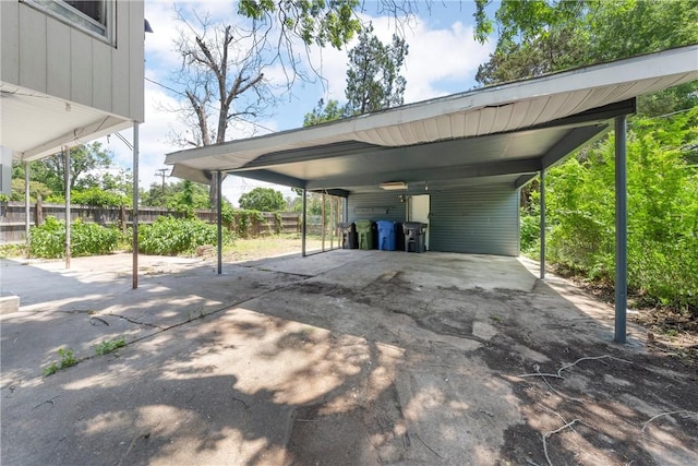 view of vehicle parking with a carport