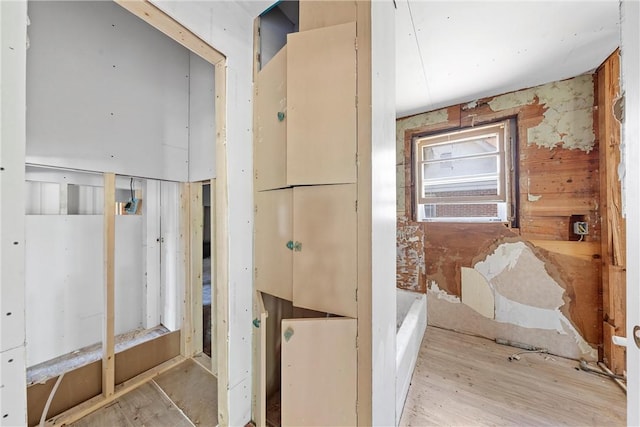 bathroom with hardwood / wood-style flooring