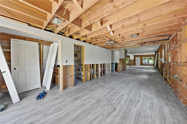 basement with hardwood / wood-style flooring