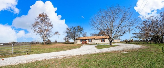 single story home featuring a front yard