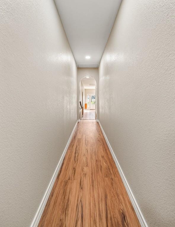 hallway with light wood-type flooring