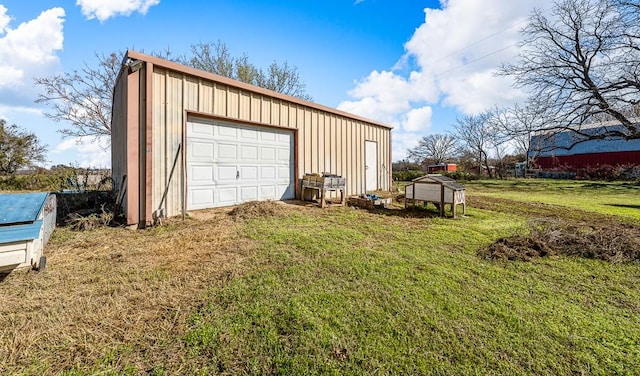 garage with a yard