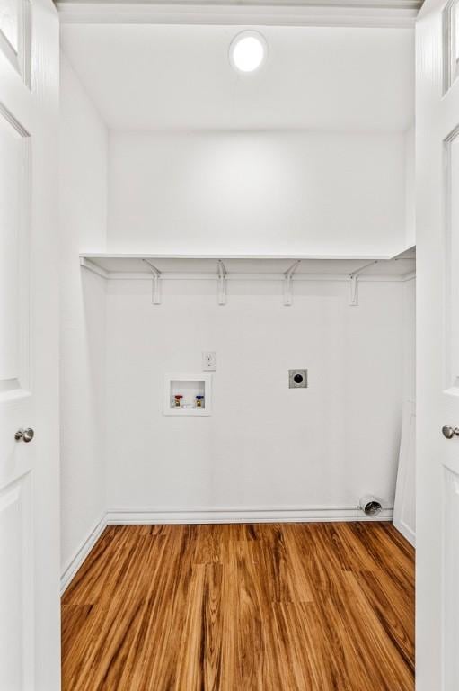 laundry room featuring hookup for a washing machine, hardwood / wood-style flooring, and electric dryer hookup