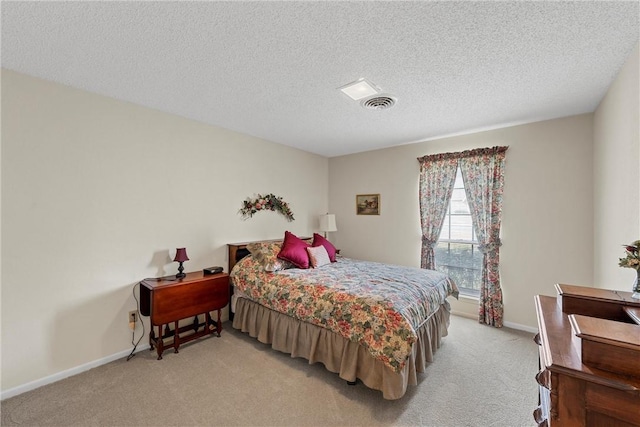 carpeted bedroom with a textured ceiling