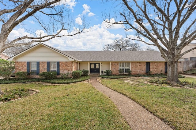 ranch-style home with a front lawn