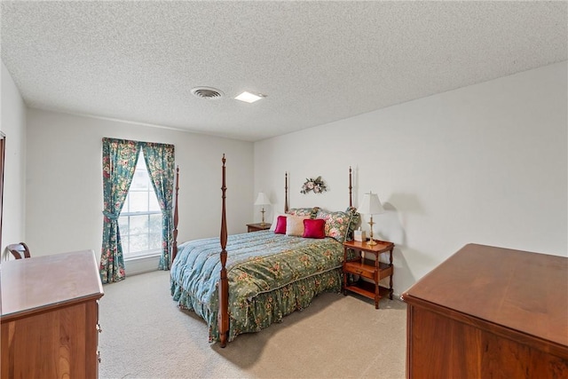 carpeted bedroom featuring a textured ceiling