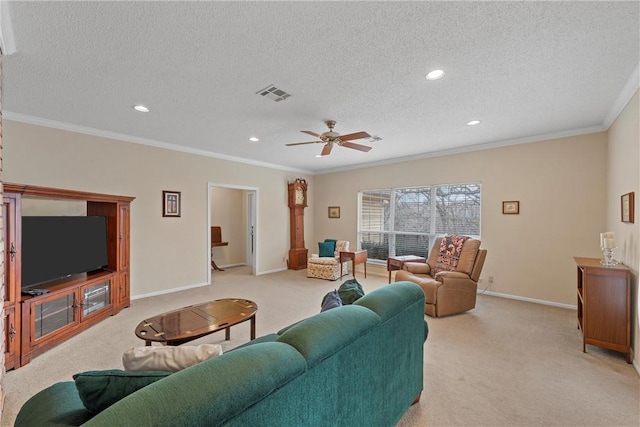 living room featuring ornamental molding, light carpet, and a textured ceiling