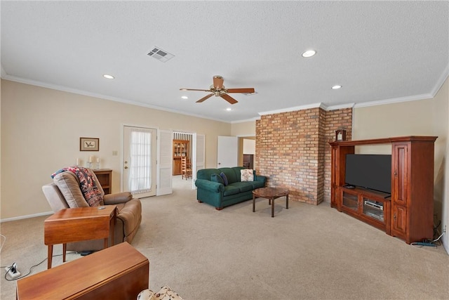 living room featuring crown molding, light carpet, ceiling fan, and a textured ceiling